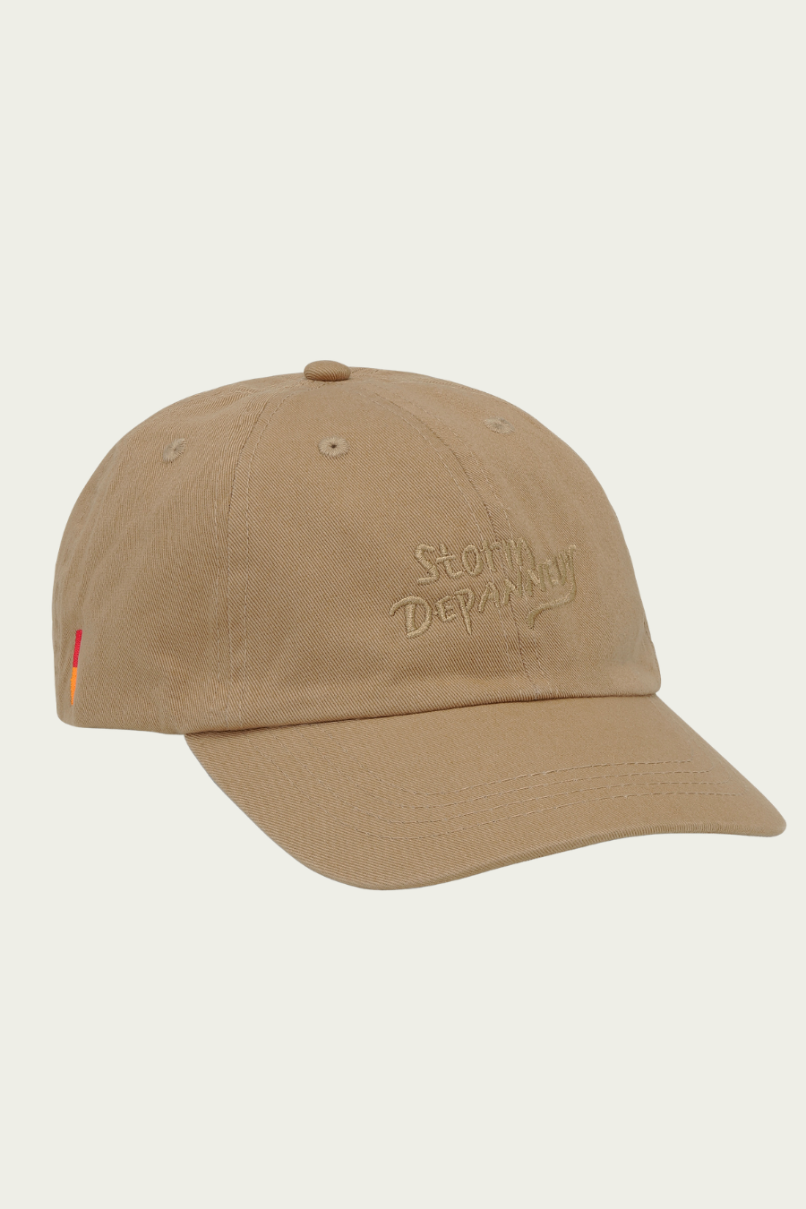 Beige cap with Storm Depanneur on the front. 