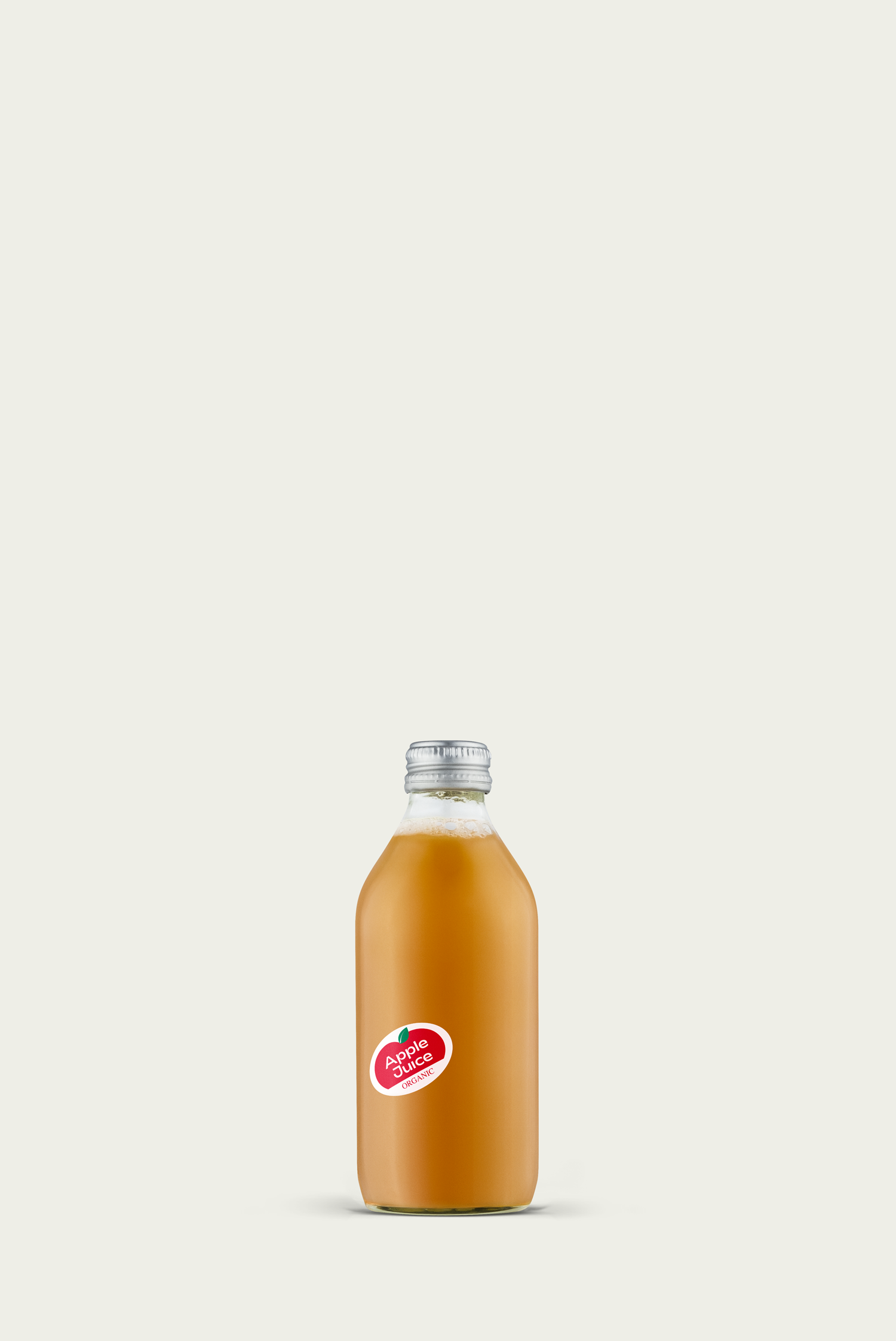 A glass bottle of Depanneur organic apple juice with a red label on a white background.