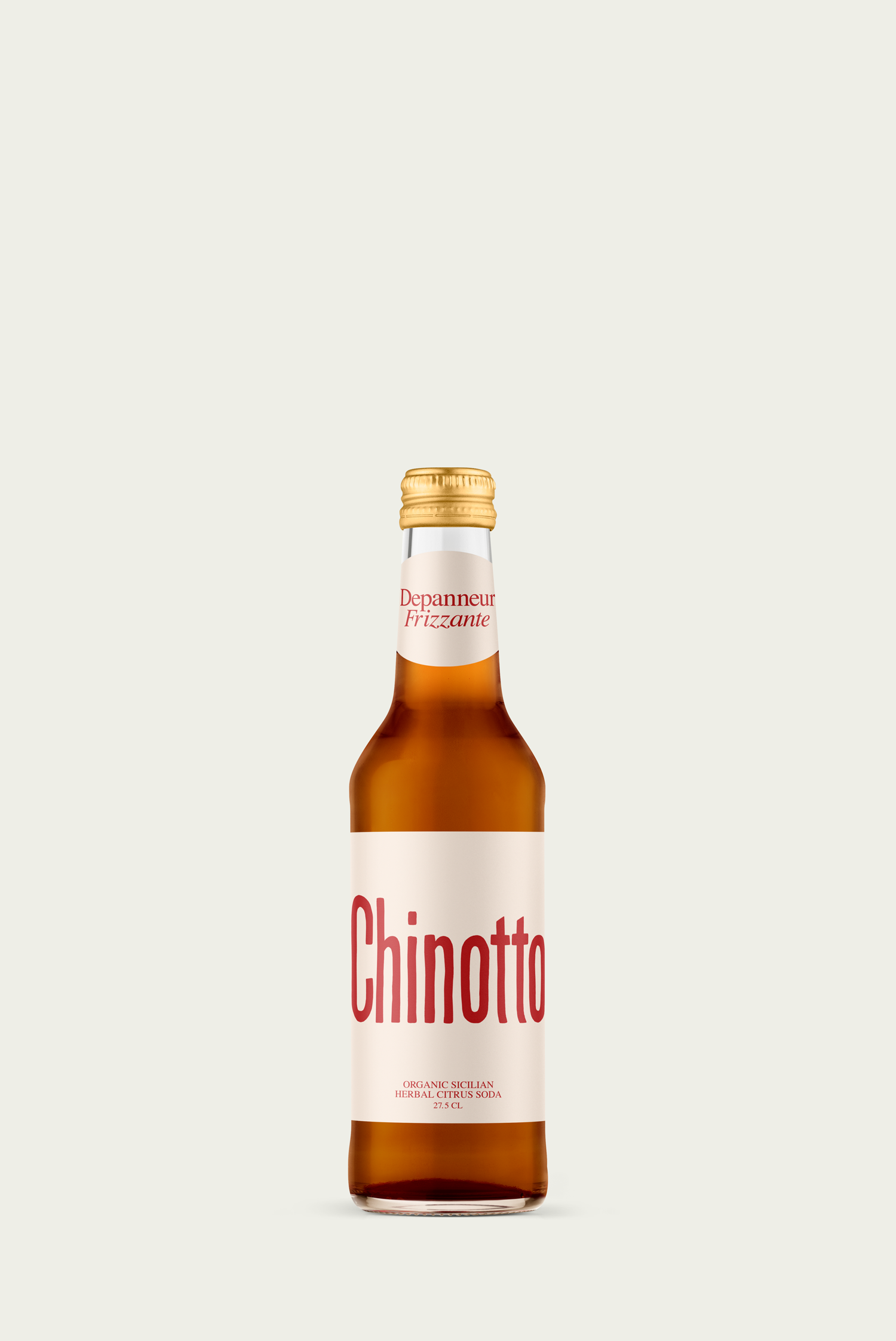 A glass bottle of organic Sicilian Chinotto herbal soda with a white label and red text.