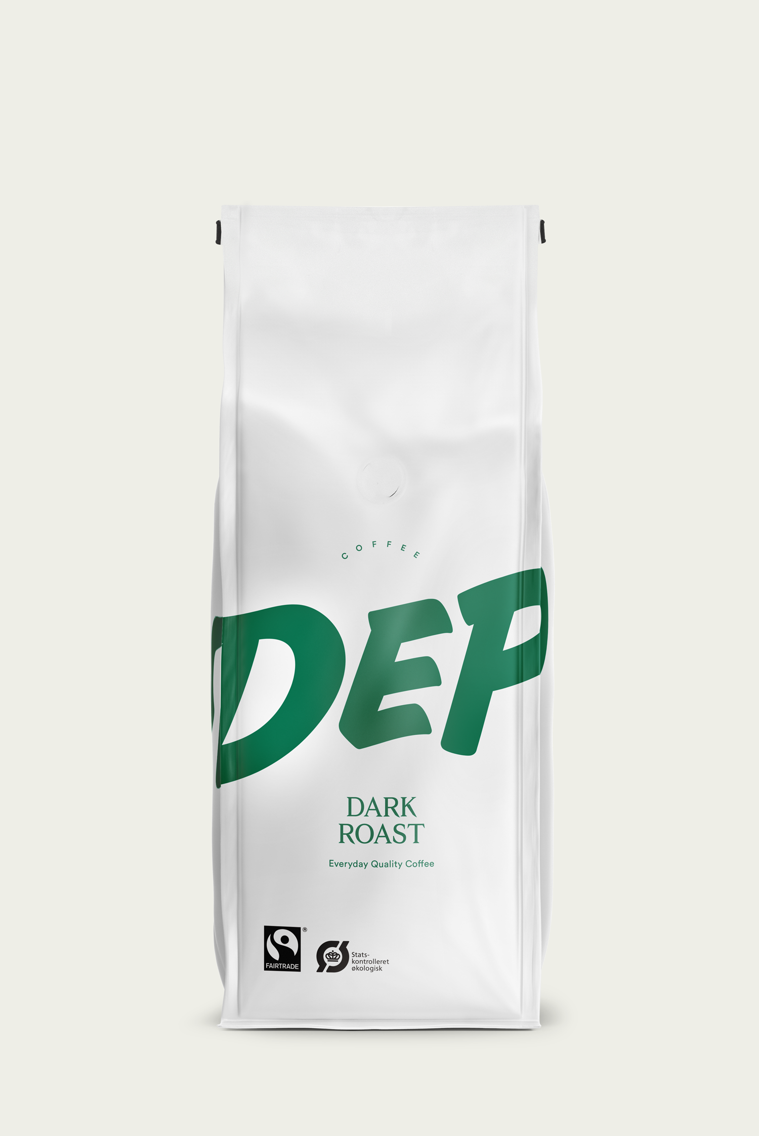 A pack of Depanneur dark roast organic whole bean coffee with the brand name and 'DARK ROAST' text visible on the front, against a white background.
