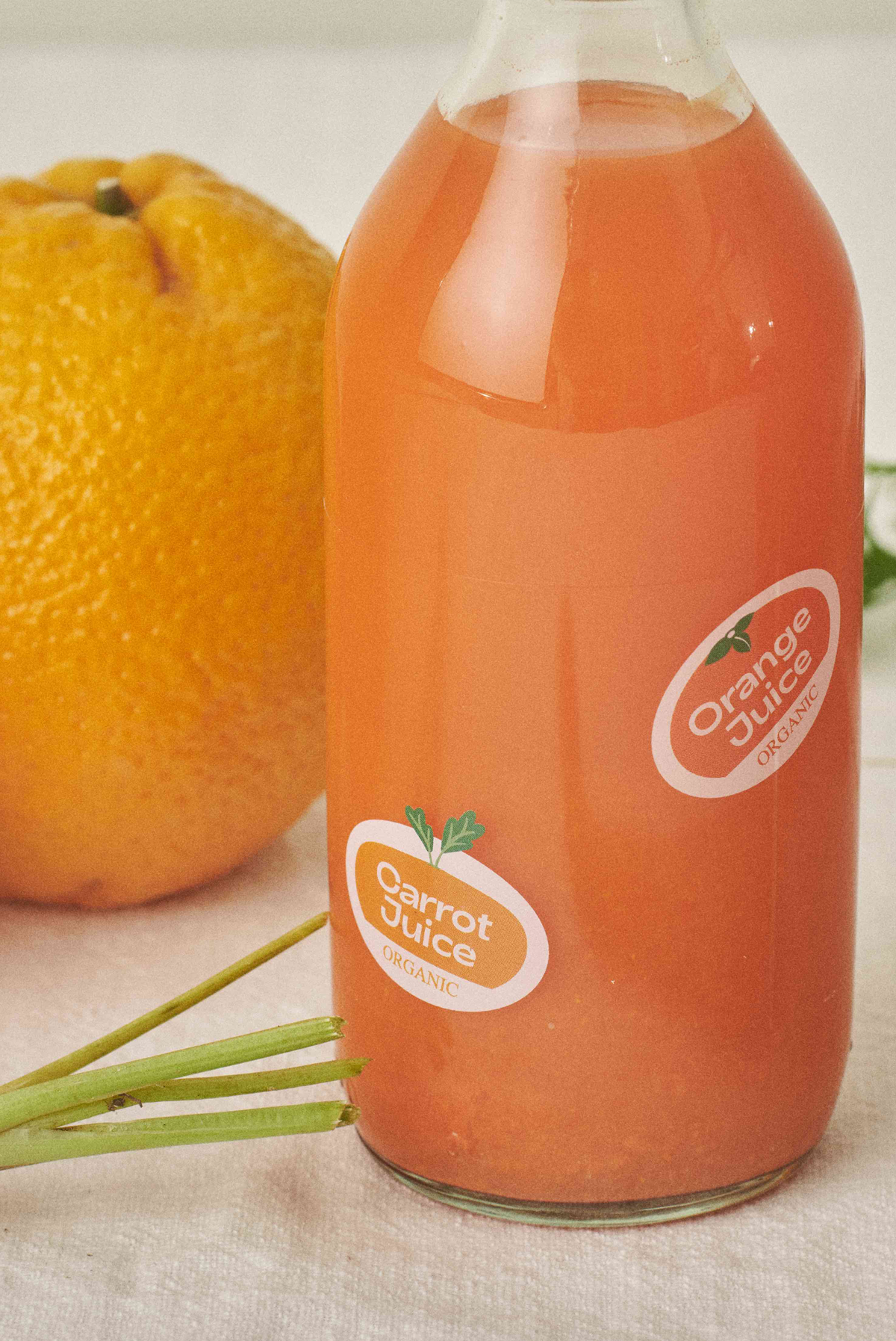 A bottle of organic Orange and Carrot juice. 